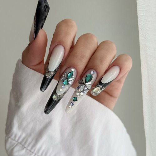 Long almond nails with black and emerald crystal nail art