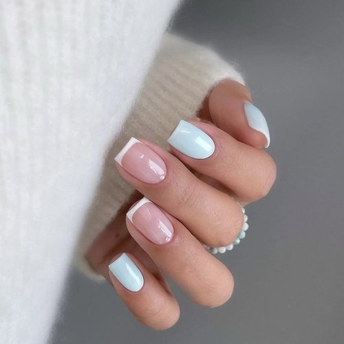 Short French manicure with pale blue accent nails