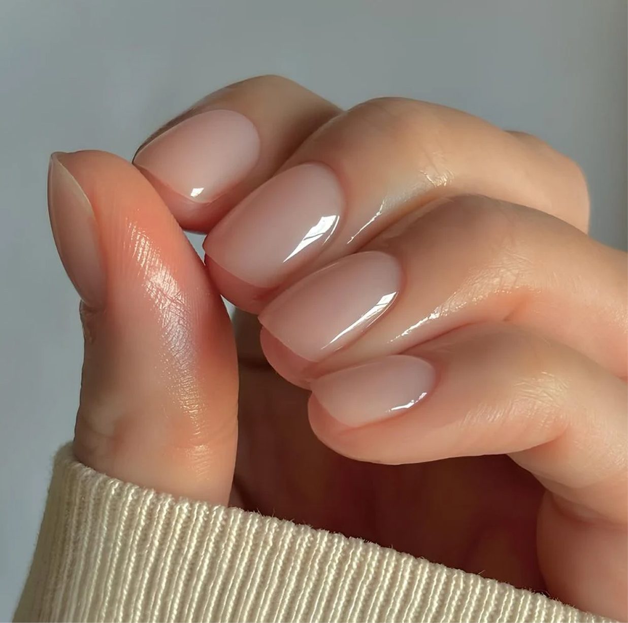 Clean e-file manicure result — nude gel polish