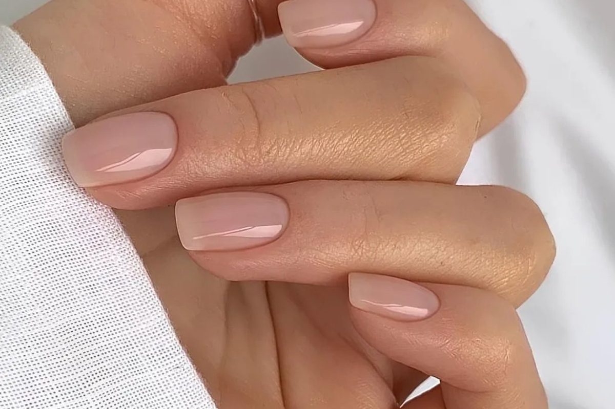 Sheer nude gel manicure on healthy, intact cuticle skin